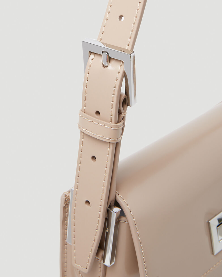Beige patent leather shoulder bag with dual compartments and silver turnlock closures — Endless | Endless UAE