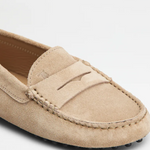 Beige suede junior driving loafer with black rubber sole and stitched detailing — Tod's | Endless UAE