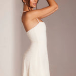 White halter A-line mini dress with embellished detail on model wearing metallic sandals — Oh Polly | Endless UAE