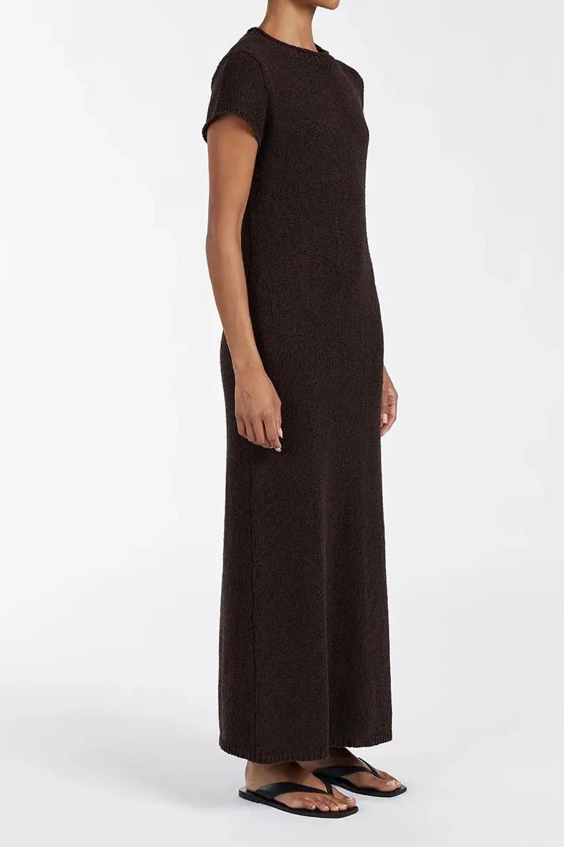 Woman wearing dark brown ribbed knit midi dress with short sleeves and front slit — DISSH | Endless UAE
