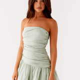 Sage green strapless bubble mini dress with ruched detailing and scalloped hem — Peppermayo | Endless UAE