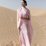 Woman wearing pink textured maxi dress in desert setting — Lichi | Endless UAE