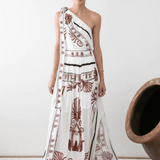 One shoulder white top with brown ornate print and black trim details — Ancient Kallos | Endless UAE