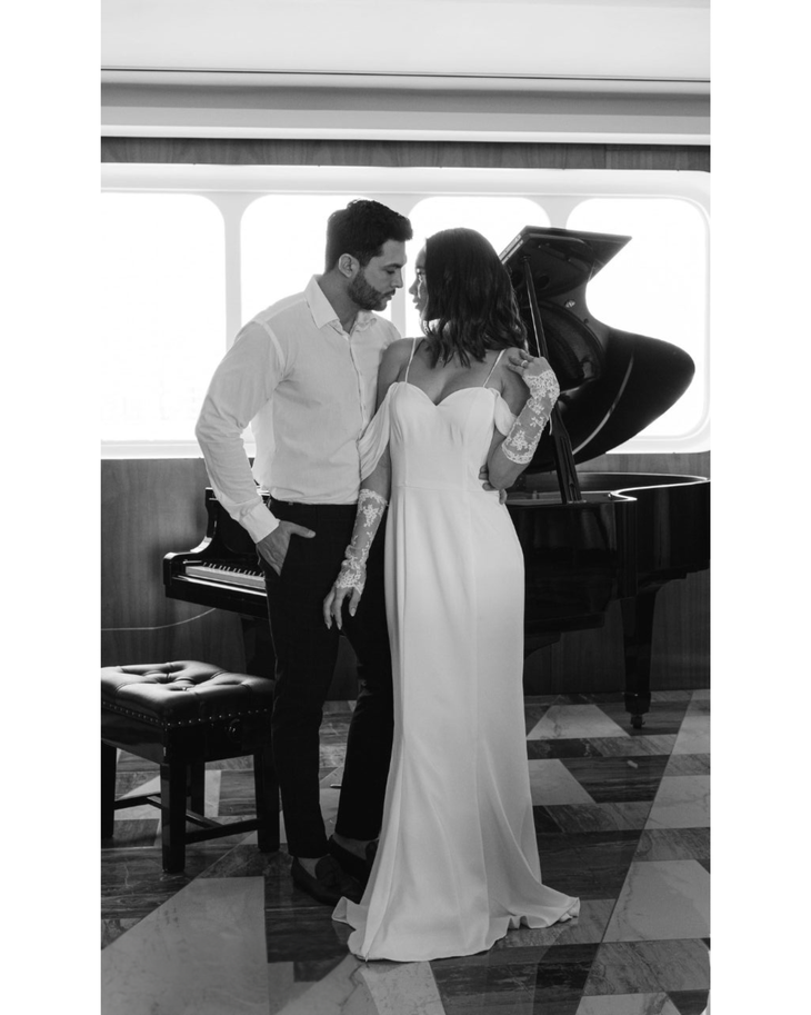 Bride in white convertible wedding dress with floral embellishments and flowing train — Dressarte Paris | Endless UAE