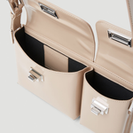Beige patent leather shoulder bag with dual compartments and silver turnlock closures — Endless | Endless UAE