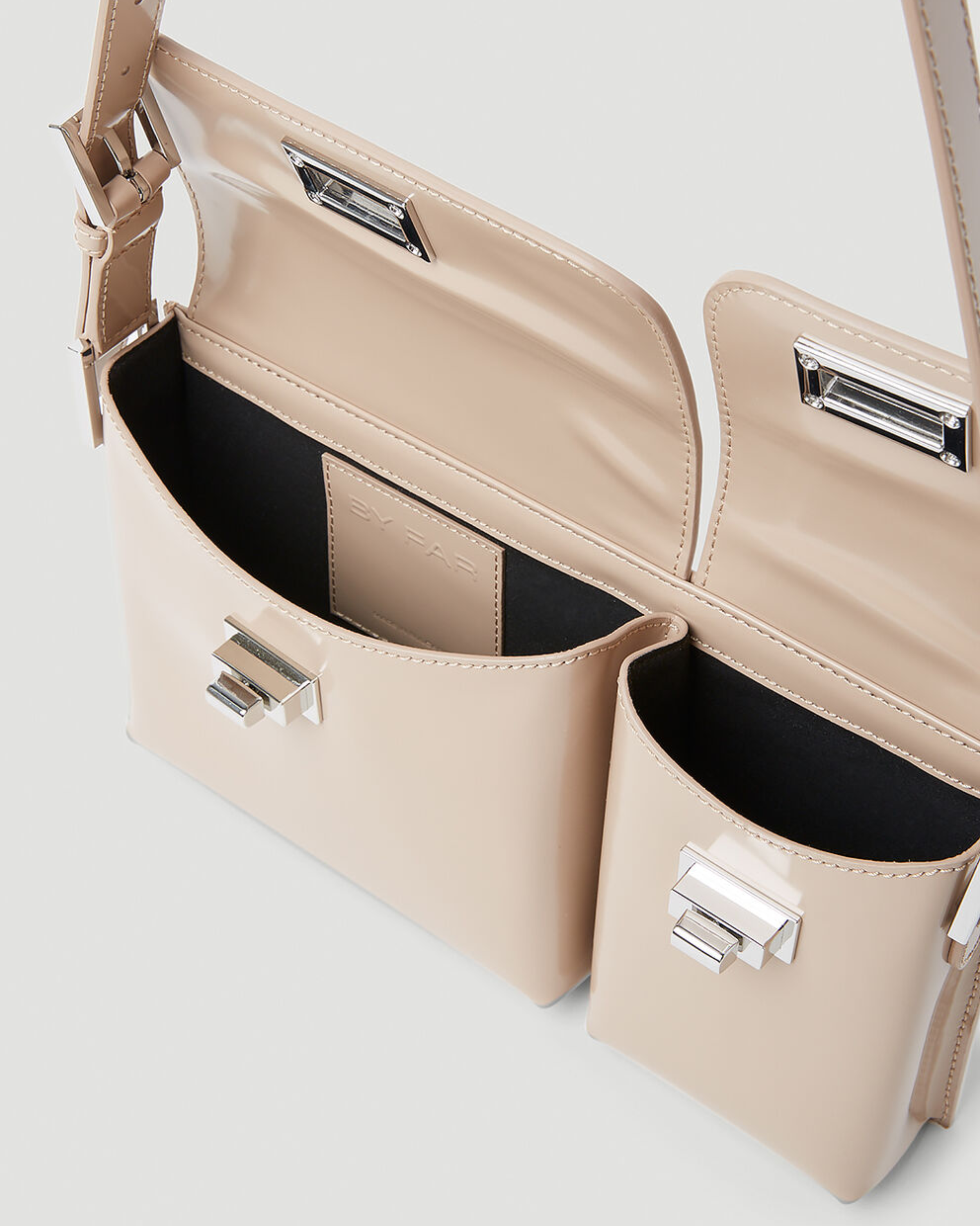 Beige patent leather shoulder bag with dual compartments and silver turnlock closures — Endless | Endless UAE
