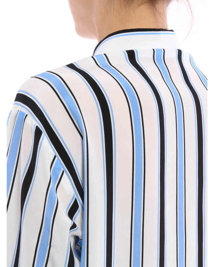 Striped silk shirt with blue, black and white diagonal stripes paired with dark blue jeans — M.S.G.M | Endless UAE
