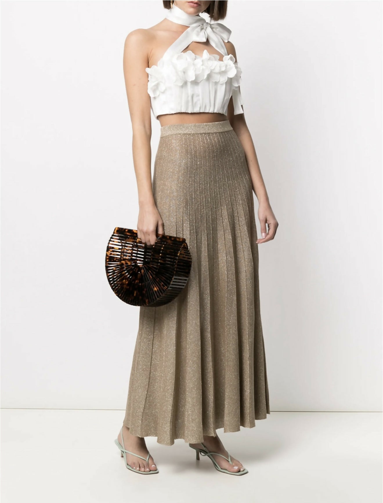 White halter crop top with ruffled floral appliqué detail and neck tie, paired with metallic pleated maxi skirt — Zimmermann | Endless UAE
