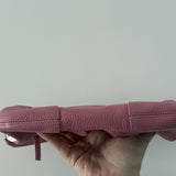 Pink leather mini shoulder bag with dual handles displayed against neutral background — By Far | Endless UAE