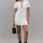 White double-breasted blazer dress with short sleeves and pleated mini skirt hem — Amanda Uprichard | Endless UAE