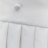 White mini dress with pleated skirt and button detail on white background — Amanda Uprichard | Endless UAE