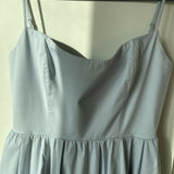 Woman wearing light blue sleeveless midi dress with corset top and full skirt — Endless | Endless UAE