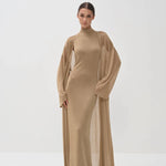 Elegant gold shimmer maxi dress with matching long cardigan, turtleneck design and flowing silhouette — Nora The Label | Endless UAE