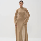 Elegant gold shimmer maxi dress with matching long cardigan, turtleneck design and flowing silhouette — Nora The Label | Endless UAE