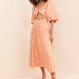 Peach crinkle textured reversible midi dress with puff sleeves, cutout waist and flowing pleated skirt — Soverè | Endless UAE