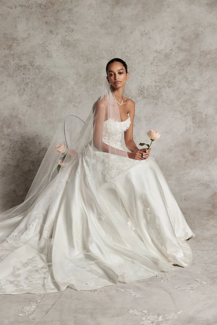 Elegant ivory ball gown wedding dress with floral appliqués and flowing veil — Justin Alexander | Endless UAE