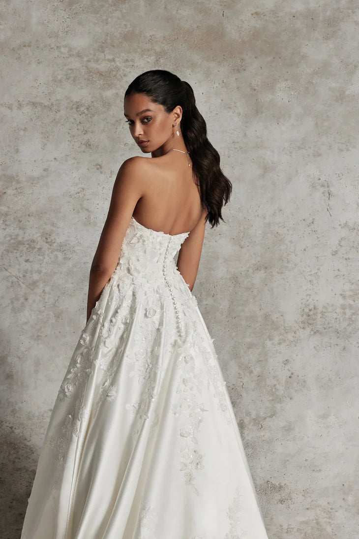 Elegant strapless ivory ballgown wedding dress with floral lace appliqués and low back — Justin Alexander | Endless UAE