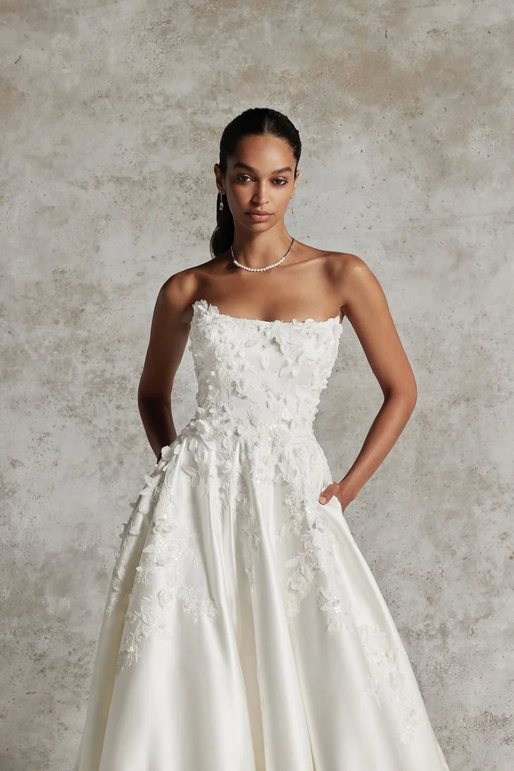 Elegant ivory strapless ball gown with 3D floral appliqués and A-line silhouette — Justin Alexander | Endless UAE