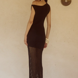 Woman wearing black off-shoulder knit maxi dress with fringe hem and white bangles — Endless | Endless UAE