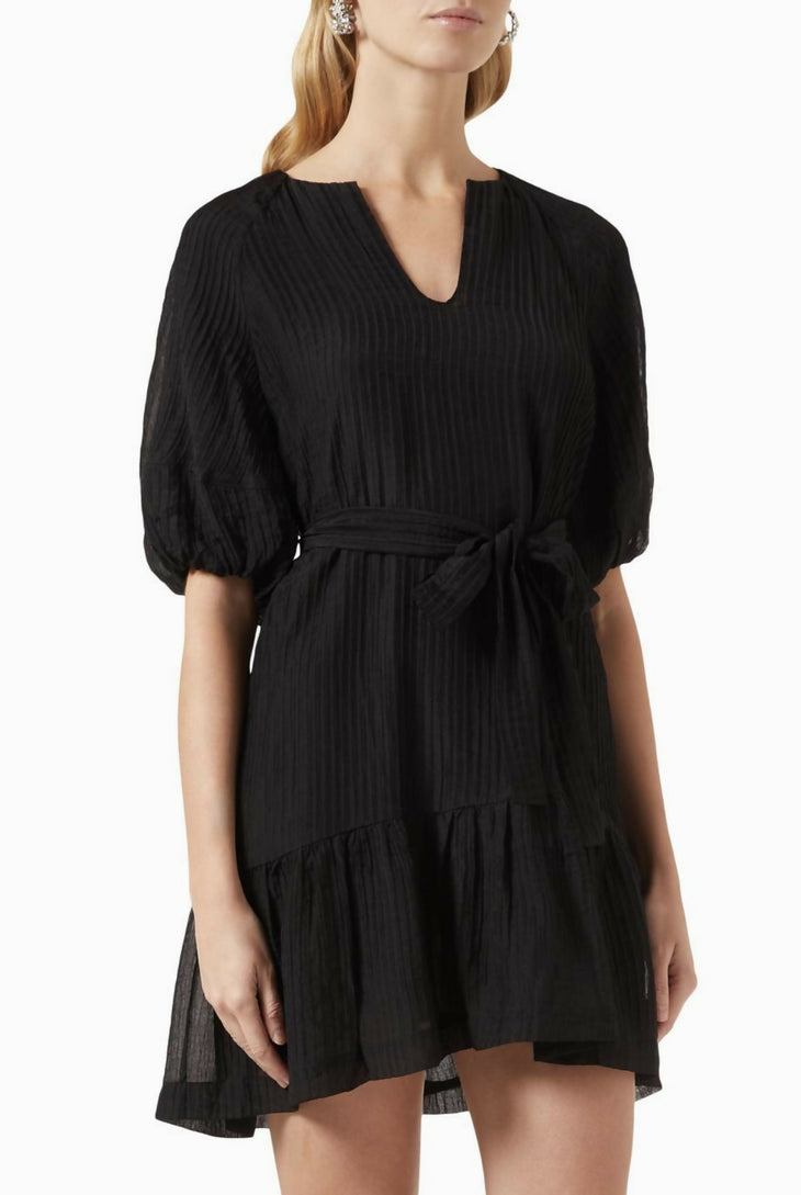Black textured mini dress with puff sleeves, V-neck, tie waist, and tiered ruffle hem on model — Minkpink | Endless UAE