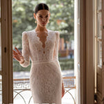 Elegant white lace wedding dress with long sleeves and flowing tulle train — Tatiana Kaplun | Endless UAE