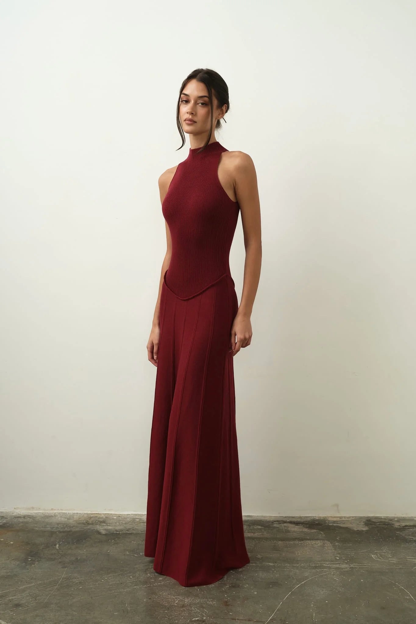 Burgundy ribbed sleeveless maxi dress with high neckline and flowing skirt — Nora the Label | Endless UAE