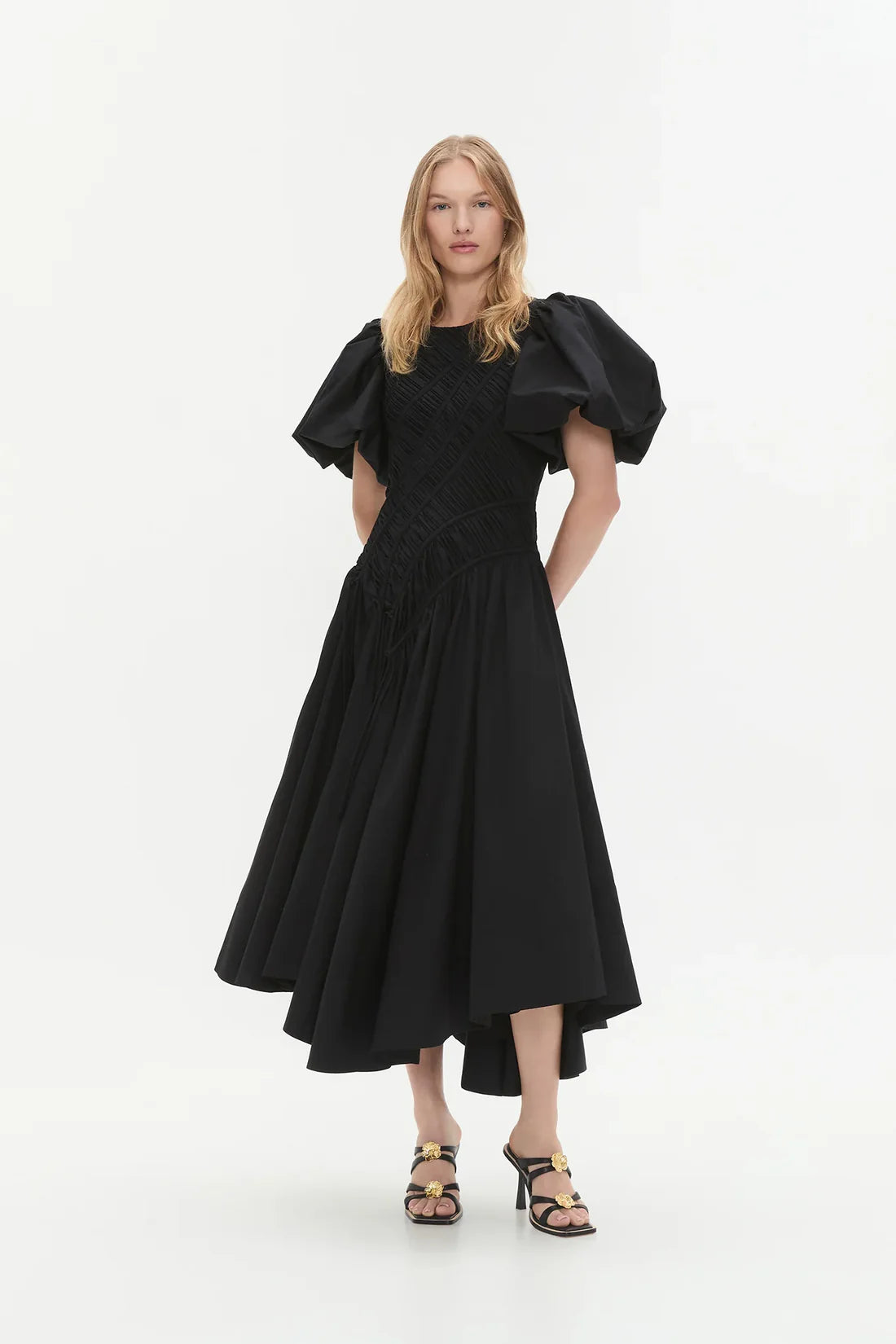 Woman wearing black Wisteria Cotton Midi Dress with puffed sleeves and asymmetrical hem — Aje | Endless UAE
