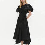 Woman wearing black Wisteria Cotton Midi Dress with puffed sleeves and asymmetrical hem — Aje | Endless UAE