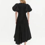 Woman wearing black Wisteria Cotton Midi Dress with puffed sleeves and asymmetrical hem — Aje | Endless UAE