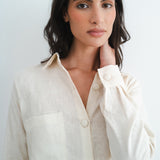 Woman wearing cream linen shirt with button details and chest pocket from relaxed Cassidy Set — Amara Grace | Endless UAE