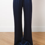 Navy blue silk wide-leg trousers with elastic waistband, full-length hem, worn with pointed heels — Amara Grace | Endless UAE