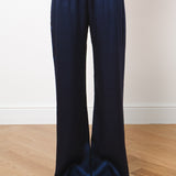 Navy blue silk wide-leg trousers with elastic waistband, full-length hem, worn with pointed heels — Amara Grace | Endless UAE