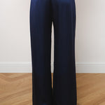 Navy blue silk wide-leg trousers with elastic waistband, rear view on model — Amara Grace | Endless UAE