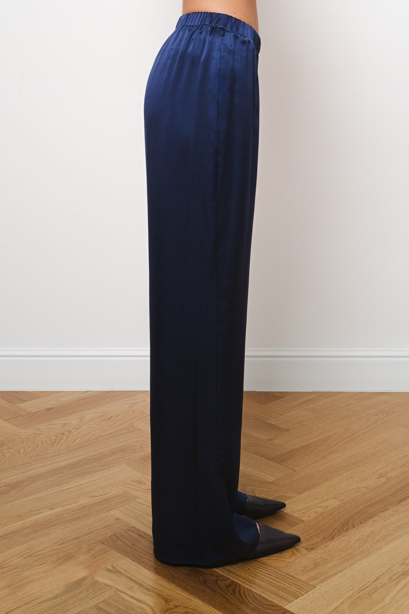 Side view of navy silk trousers with elastic waistband and relaxed wide-leg fit — Amara Grace | Endless UAE