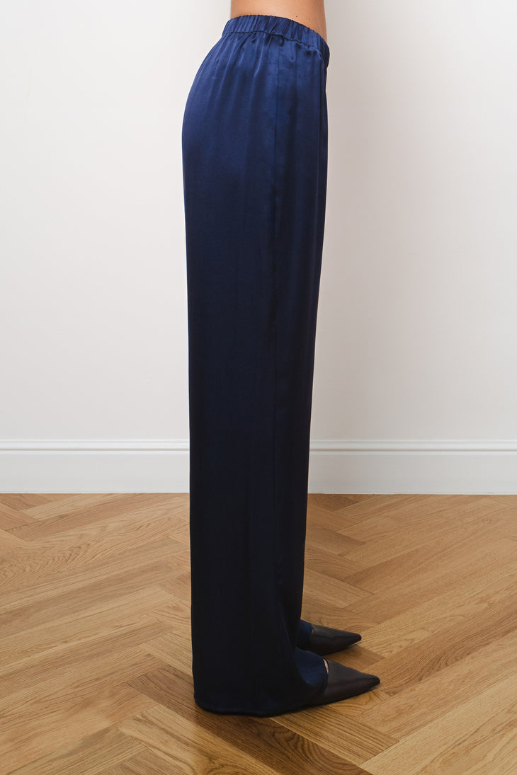 Side view of navy silk trousers with elastic waistband and relaxed wide-leg fit — Amara Grace | Endless UAE