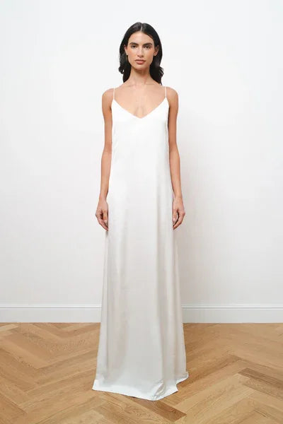Elegant white satin maxi dress with thin straps and V-neckline, floor-length silhouette — Amara Grace | Endless UAE