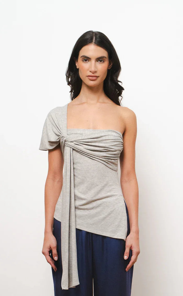 Mimi one-shoulder asymmetric top in grey heather with draped tie detail and navy trousers — Amara Grace | Endless UAE