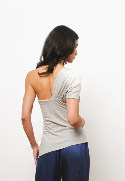 Grey one-shoulder asymmetric top with ruched detailing, back view — Amara Grace | Endless UAE