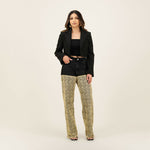 Black denim shorts with patterned beige wide-leg pants underneath, styled with a cropped black blazer — Quab | Endless UAE