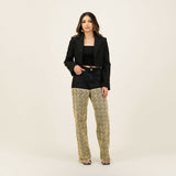 Black denim shorts with patterned beige wide-leg pants underneath, styled with a cropped black blazer — Quab | Endless UAE