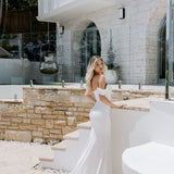 Elegant white off-shoulder wedding gown with draped details and train — Miss Chloe | Endless UAE