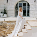 Elegant white off-shoulder wedding gown with draped details and train — Miss Chloe | Endless UAE