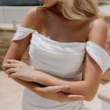 Elegant white off-shoulder wedding gown with draped details and train — Miss Chloe | Endless UAE
