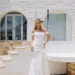 Elegant white off-shoulder wedding gown with draped details and train — Miss Chloe | Endless UAE