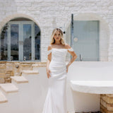 Elegant white off-shoulder wedding gown with draped details and train — Miss Chloe | Endless UAE