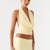 Pale yellow halter crop top and maxi skirt co-ord set — Peppermayo | Endless UAE