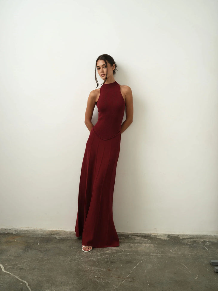 Burgundy ribbed sleeveless maxi dress with high neckline and flowing skirt — Nora the Label | Endless UAE