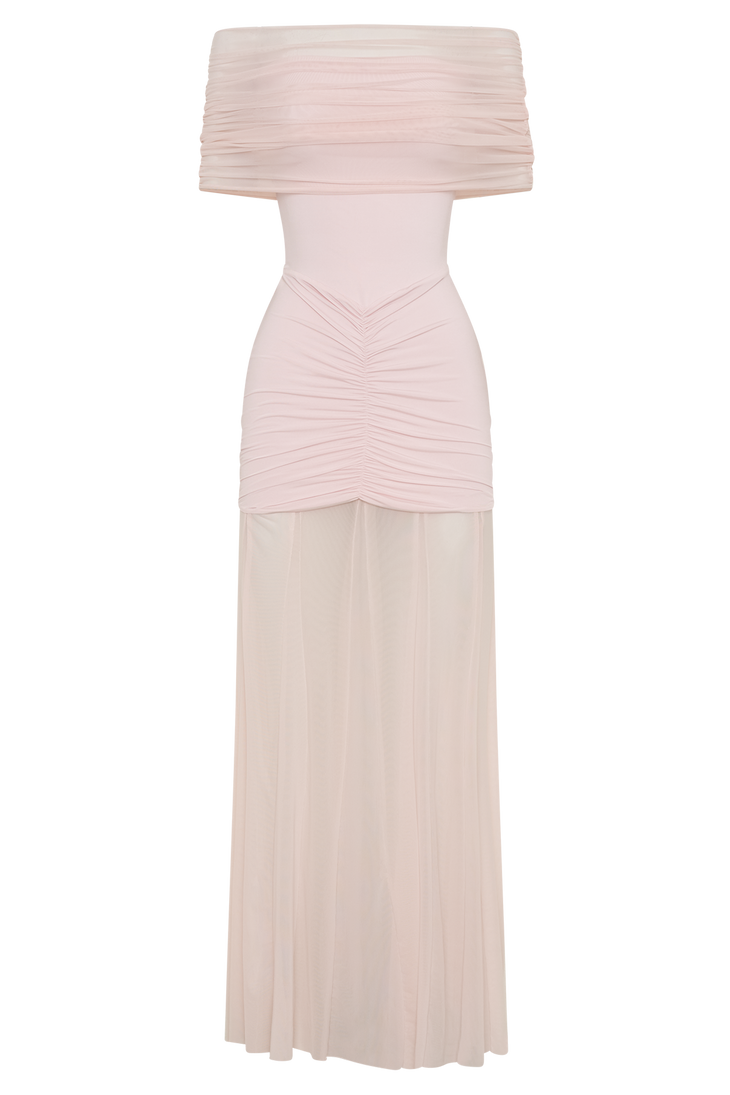 Woman wearing blush off-shoulder maxi dress with ruched details and mesh panel — Meshki | Endless UAE