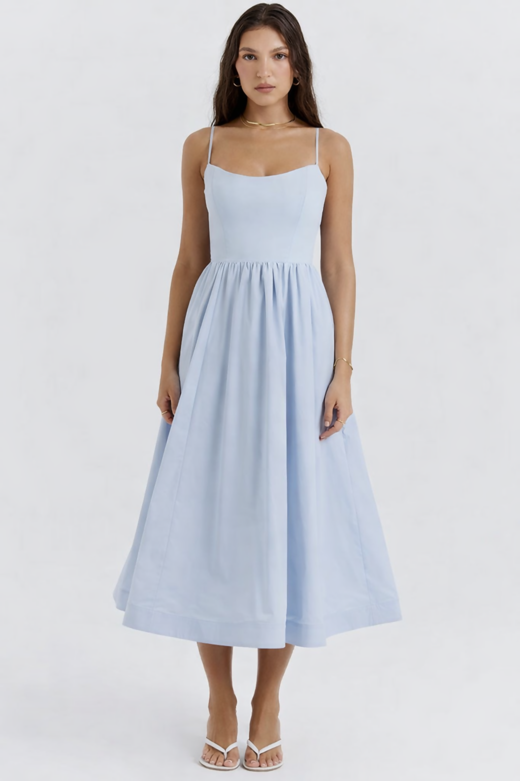 Woman wearing light blue sleeveless midi dress with corset top and full skirt — Endless | Endless UAE