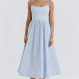 Woman wearing light blue sleeveless midi dress with corset top and full skirt — Endless | Endless UAE